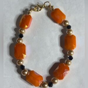 Handmade bracelet orange black gold tone beads Elegant 7.5 inches with clasp